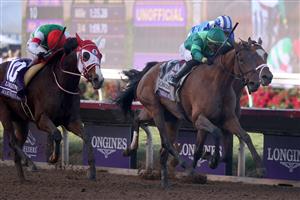 DEL MAR, CALIFORNIA - NOVEMBER 06: Jockey Oisin Murphy aboard Marche Lorraine (L) comes from behind to beat Jose Ortiz and Dunbar Road during the Breeders' Cup Mile at Del Mar Race Track on November 06, 2021 in Del Mar, California. (Photo by Rob Carr/Getty Images)