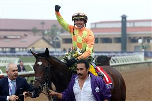 DEL MAR, CALIFORNIA - NOVEMBER 05: Jockey Jose Ortiz celebrates aboard Pizza Bianca after riding the horse to victory in the Breeders' Cup Juvenile Fillies Turf at Del Mar Race Track on November 05, 2021 in Del Mar, California. (Photo by Rob Carr/Getty Images)
