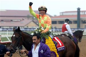 DEL MAR, CALIFORNIA - NOVEMBER 05: Jockey Jose Ortiz celebrates aboard Pizza Bianca after riding the horse to victory in the Breeders' Cup Juvenile Fillies Turf at Del Mar Race Track on November 05, 2021 in Del Mar, California. (Photo by Rob Carr/Getty Images)