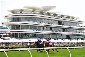 MELBOURNE, AUSTRALIA - NOVEMBER 06: Nash Rawiller riding #1 Warning wins race 2, the Queen Elizabeth Stakes during 2021 Paramount+ Stakes Day at Flemington Racecourse on November 06, 2021 in Melbourne, Australia. (Photo by Vince Caligiuri/Getty Images)