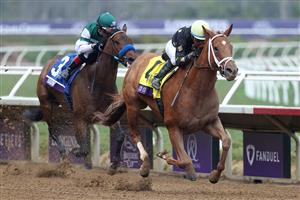 DEL MAR, CALIFORNIA - NOVEMBER 06: Jockey Victor Espinoza rides Ce Ce to win the Breeders' Cup Filly & Mare Sprint at Del Mar Race Track on November 06, 2021 in Del Mar, California. (Photo by Rob Carr/Getty Images)