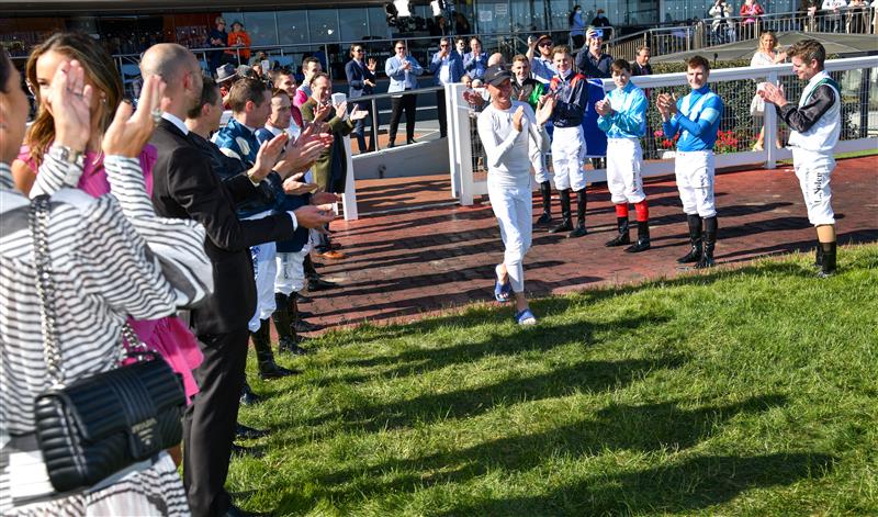MELBOURNE, AUSTRALIA - NOVEMBER 27: Glen Boss is given a guard of honour after riding Spanish Mission to finish fourth in his last ever race ride in Race 7, the Herald Sun Zipping Classic, during Melbourne Racing at Caulfield Racecourse on November 27, 2021 in Melbourne, Australia. (Photo by Vince Caligiuri/Getty Images)