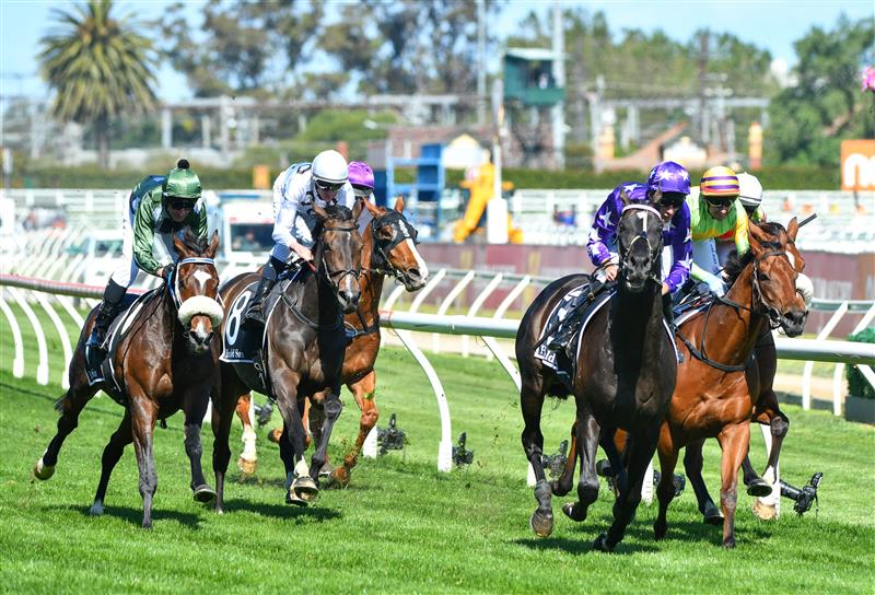 MELBOURNE, AUSTRALIA - NOVEMBER 27: Jamie Mott riding Sound winning Race 7, the Herald Sun Zipping Classic, during Melbourne Racing at Caulfield Racecourse on November 27, 2021 in Melbourne, Australia. Glen Boss riding Spanish Mission (L) in his last ever race ride finishing fourth. (Photo by Vince Caligiuri/Getty Images)