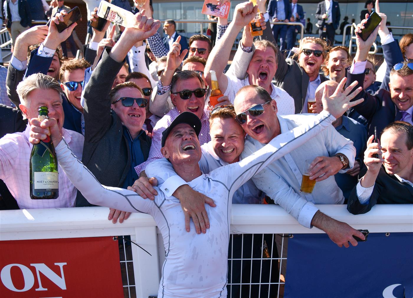 MELBOURNE, AUSTRALIA - NOVEMBER 27: Glen Boss celebrates with racegoers after riding Spanish Mission to finish fourth in his last ever race ride in Race 7, the Herald Sun Zipping Classic, during Melbourne Racing at Caulfield Racecourse on November 27, 2021 in Melbourne, Australia. (Photo by Vince Caligiuri/Getty Images)