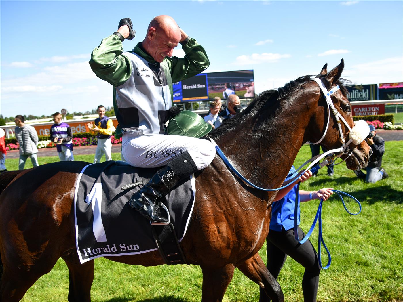 MELBOURNE, AUSTRALIA - NOVEMBER 27: Glen Boss riding Spanish Mission reacts in his last ever race ride after finishing 4th in Race 7, the Herald Sun Zipping Classic, during Melbourne Racing at Caulfield Racecourse on November 27, 2021 in Melbourne, Australia. (Photo by Vince Caligiuri/Getty Images)