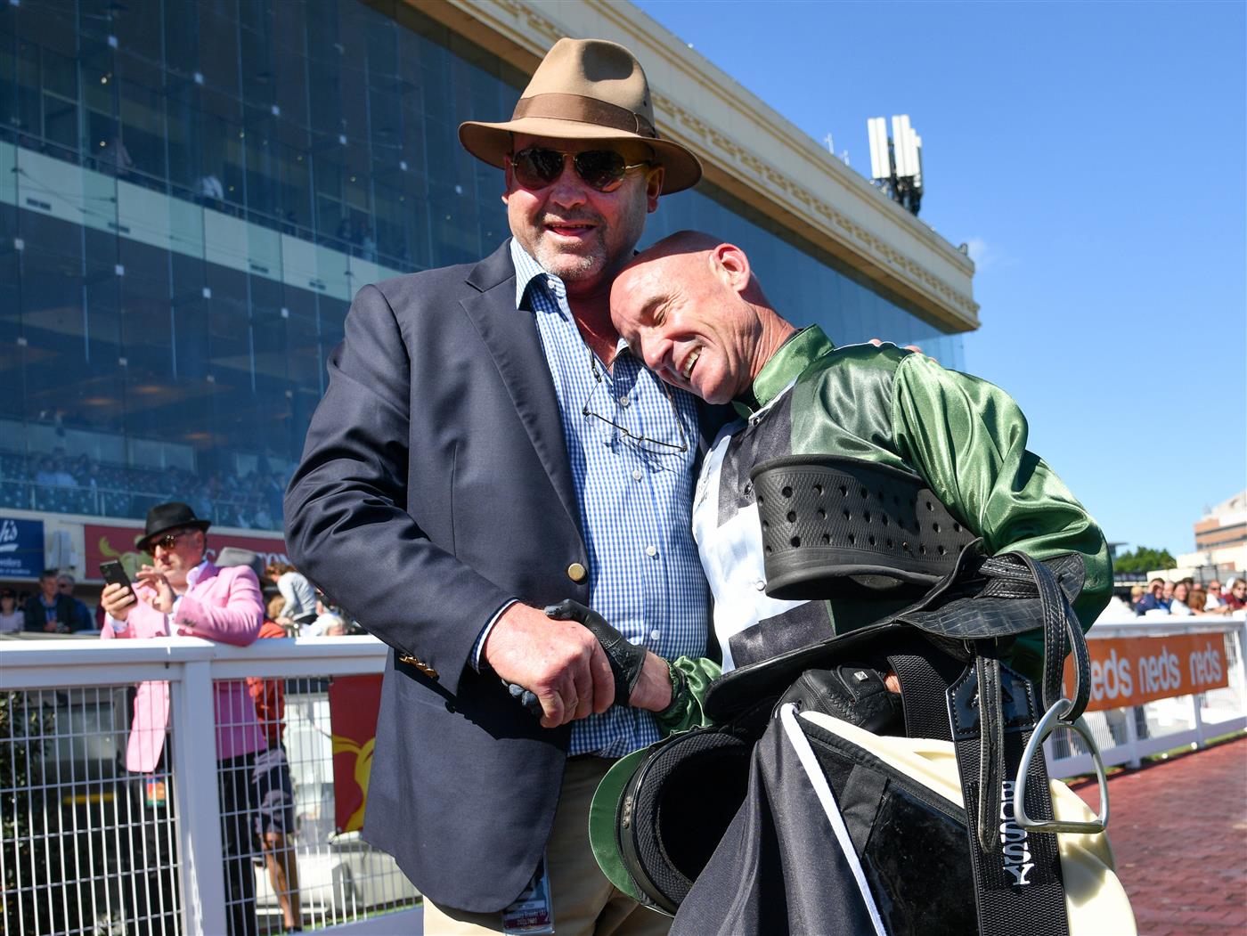MELBOURNE, AUSTRALIA - NOVEMBER 27: Glen Boss is congratulated by Trainer Peter Moody after riding Spanish Mission to finish fourth in his last ever race ride in Race 7, the Herald Sun Zipping Classic, during Melbourne Racing at Caulfield Racecourse on November 27, 2021 in Melbourne, Australia. (Photo by Vince Caligiuri/Getty Images)