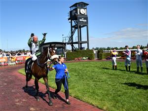 MELBOURNE, AUSTRALIA - NOVEMBER 27: Glen Boss riding Spanish Mission reacts in his last ever race ride after finishing 4th in Race 7, the Herald Sun Zipping Classic, during Melbourne Racing at Caulfield Racecourse on November 27, 2021 in Melbourne, Australia. (Photo by Vince Caligiuri/Getty Images)