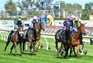 MELBOURNE, AUSTRALIA - NOVEMBER 27: Jamie Mott riding Sound winning Race 7, the Herald Sun Zipping Classic, during Melbourne Racing at Caulfield Racecourse on November 27, 2021 in Melbourne, Australia. Glen Boss riding Spanish Mission (L) in his last ever race ride finishing fourth. (Photo by Vince Caligiuri/Getty Images)