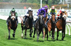 MELBOURNE, AUSTRALIA - NOVEMBER 27: Jamie Mott riding Sound winning Race 7, the Herald Sun Zipping Classic, during Melbourne Racing at Caulfield Racecourse on November 27, 2021 in Melbourne, Australia. Glen Boss riding Spanish Mission (L) in his last ever race ride finishing fourth. (Photo by Vince Caligiuri/Getty Images)