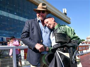 MELBOURNE, AUSTRALIA - NOVEMBER 27: Glen Boss is congratulated by Trainer Peter Moody after riding Spanish Mission to finish fourth in his last ever race ride in Race 7, the Herald Sun Zipping Classic, during Melbourne Racing at Caulfield Racecourse on November 27, 2021 in Melbourne, Australia. (Photo by Vince Caligiuri/Getty Images)
