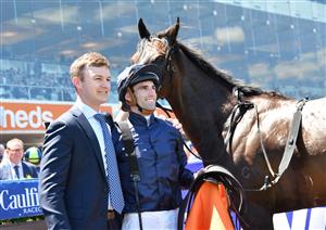 MELBOURNE, AUSTRALIA - NOVEMBER 27: Jake Noonan poses with Trainer Ben Hayes after riding Lady Of Honour to win Race 3, the Tobin Brothers Twilight Glow Stakes, during Melbourne Racing at Caulfield Racecourse on November 27, 2021 in Melbourne, Australia. (Photo by Vince Caligiuri/Getty Images)