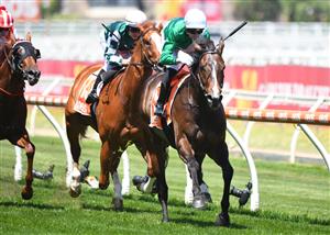 MELBOURNE, AUSTRALIA - NOVEMBER 27: Jye McNeil riding Enthaar winning Race 4, the Premier Signs Doveton Stakes, during Melbourne Racing at Caulfield Racecourse on November 27, 2021 in Melbourne, Australia. (Photo by Vince Caligiuri/Getty Images)