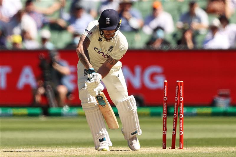 MELBOURNE, AUSTRALIA - DECEMBER 28: Ben Stokes of England is bowled out by Mitchell Starc of Australia during day three of the Third Test match in the Ashes series between Australia and England at Melbourne Cricket Ground on December 28, 2021 in Melbourne, Australia. (Photo by Robert Cianflone/Getty Images)