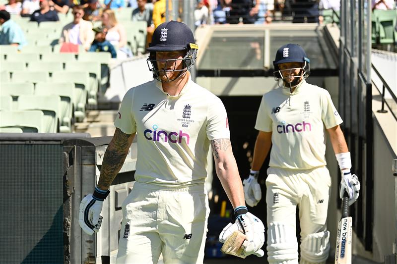 MELBOURNE, AUSTRALIA - DECEMBER 28: Ben Stokes (L) and Joe Root of England walks out to bat for day three of the Third Test match in the Ashes series between Australia and England at Melbourne Cricket Ground on December 28, 2021 in Melbourne, Australia. (Photo by Quinn Rooney/Getty Images)