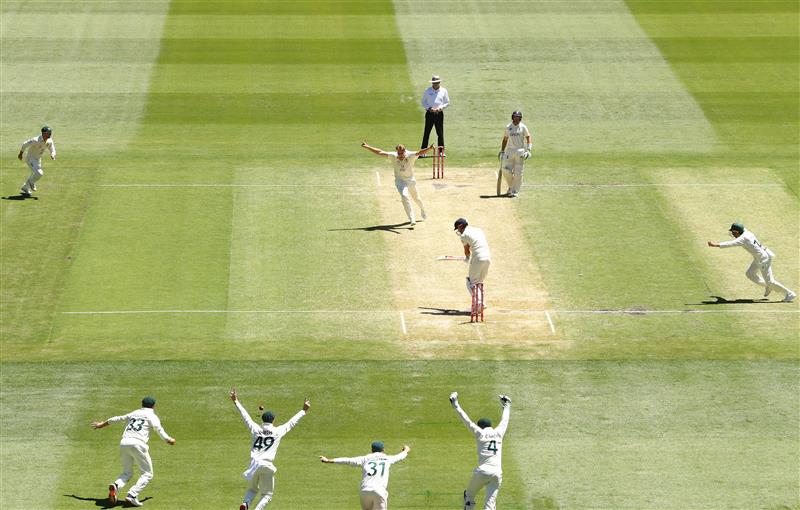MELBOURNE, AUSTRALIA - DECEMBER 28: Cameron Green of Australia celebrates after dismissing James Anderson of England and retaining the Ashes during day three of the Third Test match in the Ashes series between Australia and England at Melbourne Cricket Ground on December 28, 2021 in Melbourne, Australia. (Photo by Robert Cianflone/Getty Images)