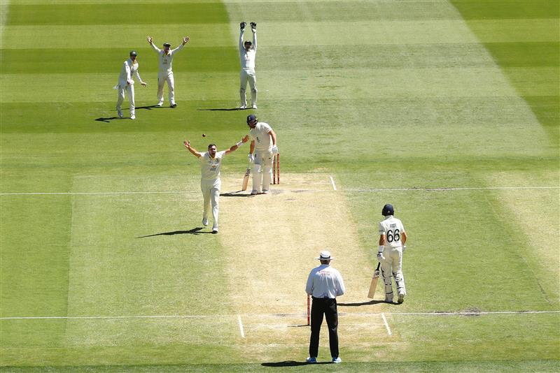 MELBOURNE, AUSTRALIA - DECEMBER 28: Scott Boland of Australia appeals successfully for LBW to dismiss Jonny Bairstow of England during day three of the Third Test match in the Ashes series between Australia and England at Melbourne Cricket Ground on December 28, 2021 in Melbourne, Australia. (Photo by Robert Cianflone/Getty Images)