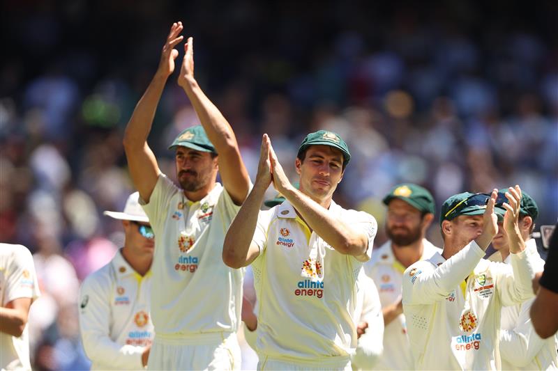 MELBOURNE, AUSTRALIA - DECEMBER 28: Pat Cummins (C)of Australia applauds with teammates after winning and retaining the Ashes on day three of the Third Test match in the Ashes series between Australia and England at Melbourne Cricket Ground on December 28, 2021 in Melbourne, Australia. (Photo by Robert Cianflone/Getty Images)
