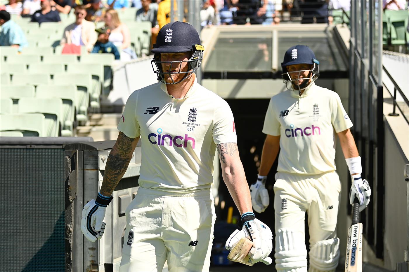 MELBOURNE, AUSTRALIA - DECEMBER 28: Ben Stokes (L) and Joe Root of England walks out to bat for day three of the Third Test match in the Ashes series between Australia and England at Melbourne Cricket Ground on December 28, 2021 in Melbourne, Australia. (Photo by Quinn Rooney/Getty Images)