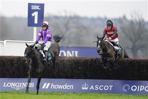 ASCOT, ENGLAND - JANUARY 22: David Maxwell riding Cat Tiger (red) clear the last to win The SBK Handicap Chase from Jonjo O'Neill Jr and Cobolobo (purple) at Ascot Racecourse on January 22, 2022 in Ascot, England. (Photo by Alan Crowhurst/Getty Images)