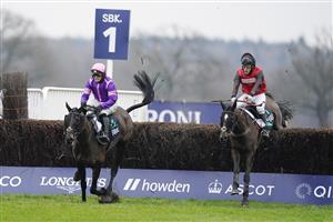 ASCOT, ENGLAND - JANUARY 22: David Maxwell riding Cat Tiger (red) clear the last to win The SBK Handicap Chase from Jonjo O'Neill Jr and Cobolobo (purple) at Ascot Racecourse on January 22, 2022 in Ascot, England. (Photo by Alan Crowhurst/Getty Images)