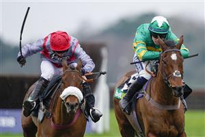 ASCOT, ENGLAND - JANUARY 22: Kevin Brogan riding Phoenix Way (green) clear the last to win The bet365 Handicap Chase from Lucy Turner and Fanion D'Estruval (L) at Ascot Racecourse on January 22, 2022 in Ascot, England. (Photo by Alan Crowhurst/Getty Images)