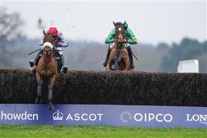 ASCOT, ENGLAND - JANUARY 22: Kevin Brogan riding Phoenix Way (green) clear the last to win The bet365 Handicap Chase from Lucy Turner and Fanion D'Estruval (L) at Ascot Racecourse on January 22, 2022 in Ascot, England. (Photo by Alan Crowhurst/Getty Images)