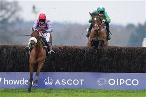 ASCOT, ENGLAND - JANUARY 22: Kevin Brogan riding Phoenix Way (green) clear the last to win The bet365 Handicap Chase from Lucy Turner and Fanion D'Estruval (L) at Ascot Racecourse on January 22, 2022 in Ascot, England. (Photo by Alan Crowhurst/Getty Images)