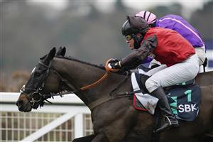 ASCOT, ENGLAND - JANUARY 22: David Maxwell riding Cat Tiger (red) clear the last to win The SBK Handicap Chase from Jonjo O'Neill Jr and Cobolobo (purple) at Ascot Racecourse on January 22, 2022 in Ascot, England. (Photo by Alan Crowhurst/Getty Images)