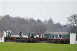 ASCOT, ENGLAND - JANUARY 22: Harry Skelton riding Unexpected Party (L) clear the last to win The SBK Holloway's Handicap Hurdle at Ascot Racecourse on January 22, 2022 in Ascot, England. (Photo by Alan Crowhurst/Getty Images)