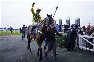 ASCOT, ENGLAND - JANUARY 22: Nico de Boinville after riding Shishkin to win The SBK Clarence House Chase from Paul Townend and Energumene (blue) at Ascot Racecourse on January 22, 2022 in Ascot, England. (Photo by Alan Crowhurst/Getty Images)