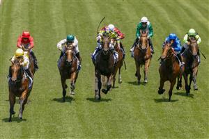 SYDNEY, AUSTRALIA - JANUARY 29: Rachel King (yellow) on Queen Of The Ball wins race 3 the Widden Stakes during Sydney Racing at Rosehill Gardens on January 29, 2022 in Sydney, Australia. (Photo by Jenny Evans/Getty Images)