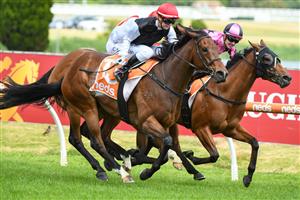 MELBOURNE, AUSTRALIA - DECEMBER 26: Jamie Kah riding Americain Angel winning  race 5,  the Ken Sturt Handicap, during Melbourne Racing at Caulfield Racecourse on December 26, 2021 in Melbourne, Australia. (Photo by Vince Caligiuri/Getty Images)