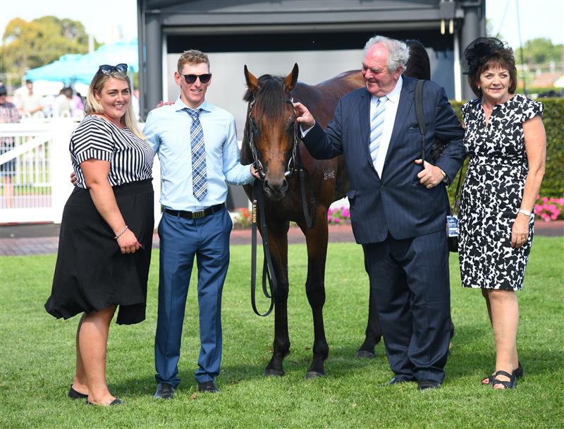MELBOURNE, AUSTRALIA - FEBRUARY 12: Trainer Maddie  Raymond  (R) poses after Earlswood won race 6, the Keno T.s. Carlyon Cup, during Melbourne Racing at Caulfield Racecourse on February 12, 2022 in Melbourne, Australia. (Photo by Vince Caligiuri/Getty Images)