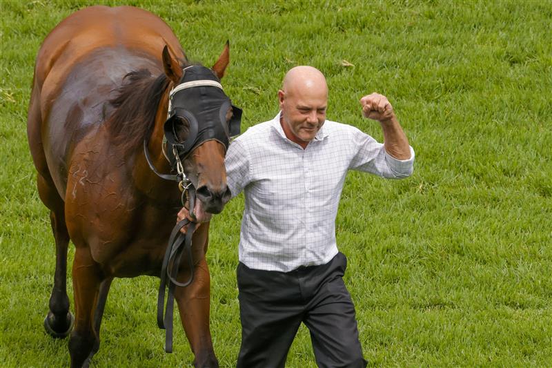 SYDNEY, AUSTRALIA - FEBRUARY 12: Trainer Wayne Seelin walks Invincible Kiss and fist pumps after winning race 4 the Midway Handicap during Sydney Racing at Royal Randwick Racecourse on February 12, 2022 in Sydney, Australia. (Photo by Jenny Evans/Getty Images)