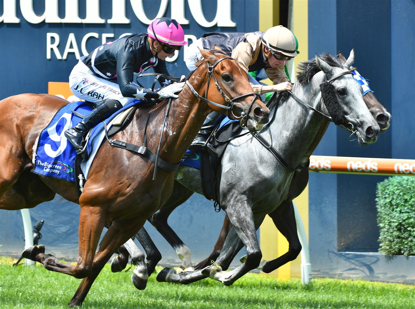 MELBOURNE, AUSTRALIA - FEBRUARY 12: Jamie Kah riding Unanimous (L) winning Race 1, the The Big Screen Company Handicap, during Melbourne Racing at Caulfield Racecourse on February 12, 2022 in Melbourne, Australia. (Photo by Vince Caligiuri/Getty Images)