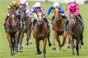 SYDNEY, AUSTRALIA - FEBRUARY 12: Hugh Bowman (pink) on Fangirl wins race 7 the Tab Light Fingers Stakes during Sydney Racing at Royal Randwick Racecourse on February 12, 2022 in Sydney, Australia. (Photo by Jenny Evans/Getty Images)