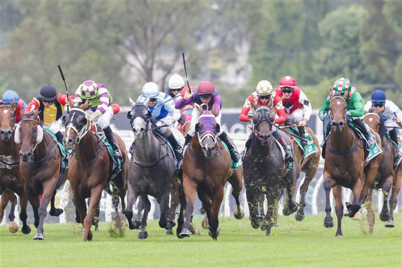 SYDNEY, AUSTRALIA - FEBRUARY 19: Jason Collett on Golden Point (green) wins race 1 the Tab Highway Handicap during Sydney Racing at Rosehill Gardens on February 19, 2022 in Sydney, Australia. (Photo by Jenny Evans/Getty Images)