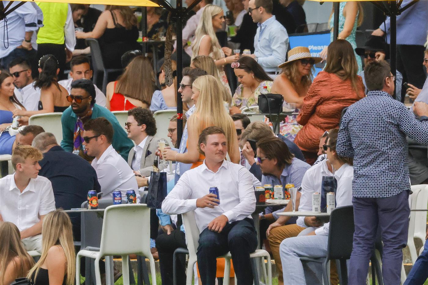 SYDNEY, AUSTRALIA - FEBRUARY 19: Race goers are seen  during Sydney Racing at Rosehill Gardens on February 19, 2022 in Sydney, Australia. (Photo by Jenny Evans/Getty Images)