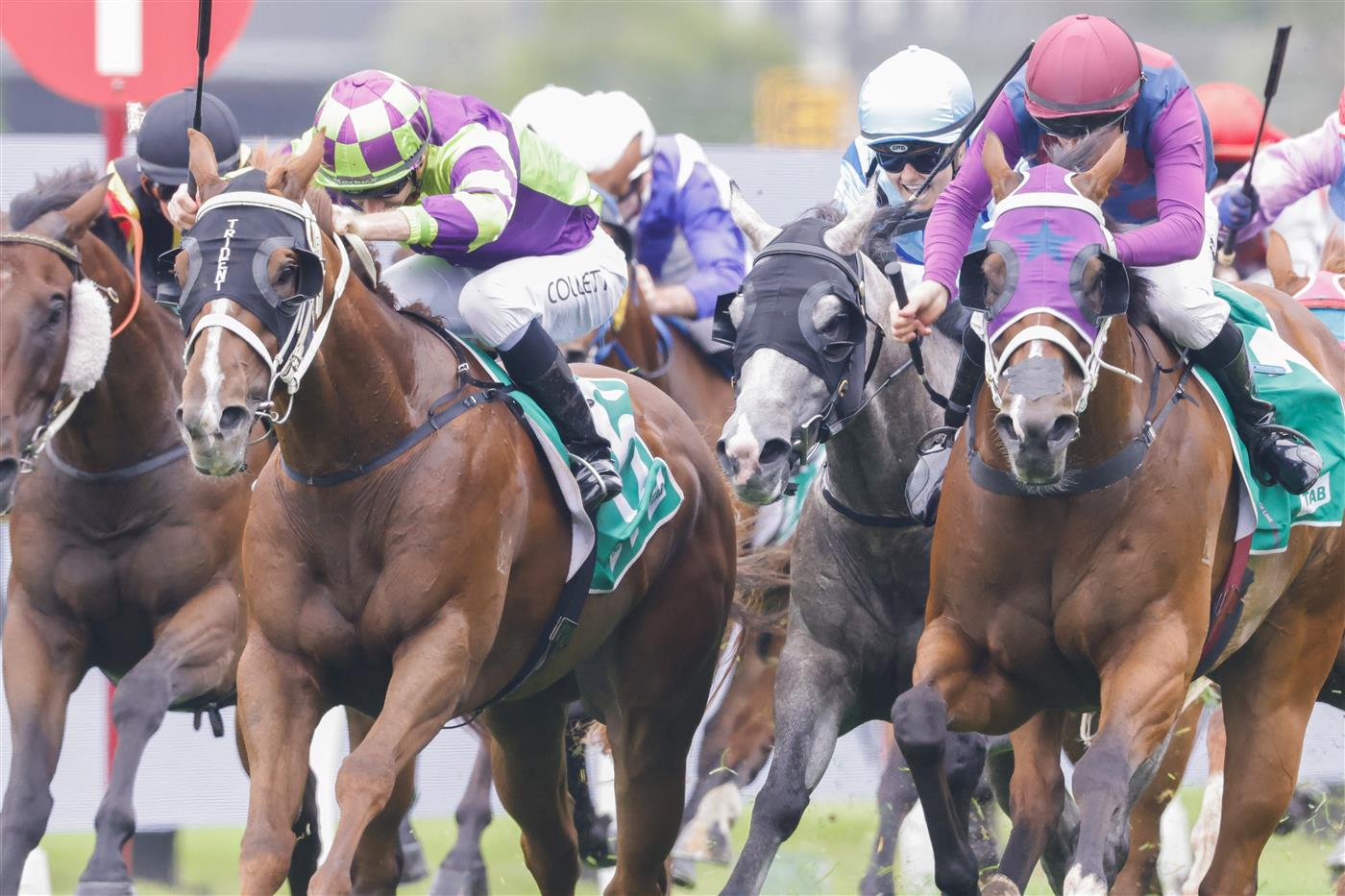 SYDNEY, AUSTRALIA - FEBRUARY 19: Jason Collett on Golden Point (green) wins race 1 the Tab Highway Handicap during Sydney Racing at Rosehill Gardens on February 19, 2022 in Sydney, Australia. (Photo by Jenny Evans/Getty Images)