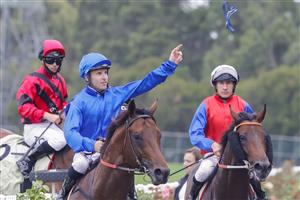 SYDNEY, AUSTRALIA - FEBRUARY 19: Tommy Berry throws his goggles to the crowd as as he returns to scale on Anamoe after winning race 8 the Petaluma Hobartville Stakes during Sydney Racing at Rosehill Gardens on February 19, 2022 in Sydney, Australia. (Photo by Jenny Evans/Getty Images)
