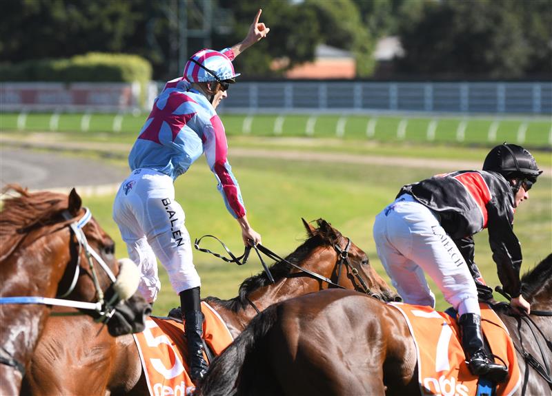 MELBOURNE, AUSTRALIA - FEBRUARY 26: Ben Allen riding Marabi winning Race 8,  the Neds Oakleigh Plate, during Melbourne Racing at Caulfield Racecourse on February 26, 2022 in Melbourne, Australia. (Photo by Vince Caligiuri/Getty Images)
