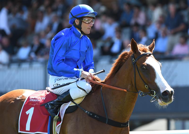 MELBOURNE, AUSTRALIA - FEBRUARY 26: Damien Oliver riding Cascadian after winning Race 5, the Carlton Draught Peter Young Stakes, during Melbourne Racing at Caulfield Racecourse on February 26, 2022 in Melbourne, Australia. (Photo by Vince Caligiuri/Getty Images)