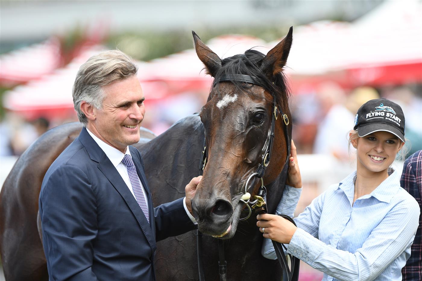 MELBOURNE, AUSTRALIA - FEBRUARY 26: Trainer Tom Dabernig poses with Flying Mascot after winning Race 2, the Catanach's Jewellers Mannerism Stakes, during Melbourne Racing at Caulfield Racecourse on February 26, 2022 in Melbourne, Australia. (Getty)