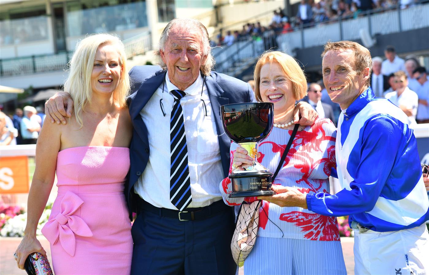 MELBOURNE, AUSTRALIA - FEBRUARY 26: Damien Oliver poses with trainer Gai Waterhouse and owner John Singleton after riding Castlereagh Kid winning Race 3, the Stow Storage Solutions Autumn Classic, during Melbourne Racing at Caulfield Racecourse on February 26, 2022 in Melbourne, Australia. (Photo by Vince Caligiuri/Getty Images)