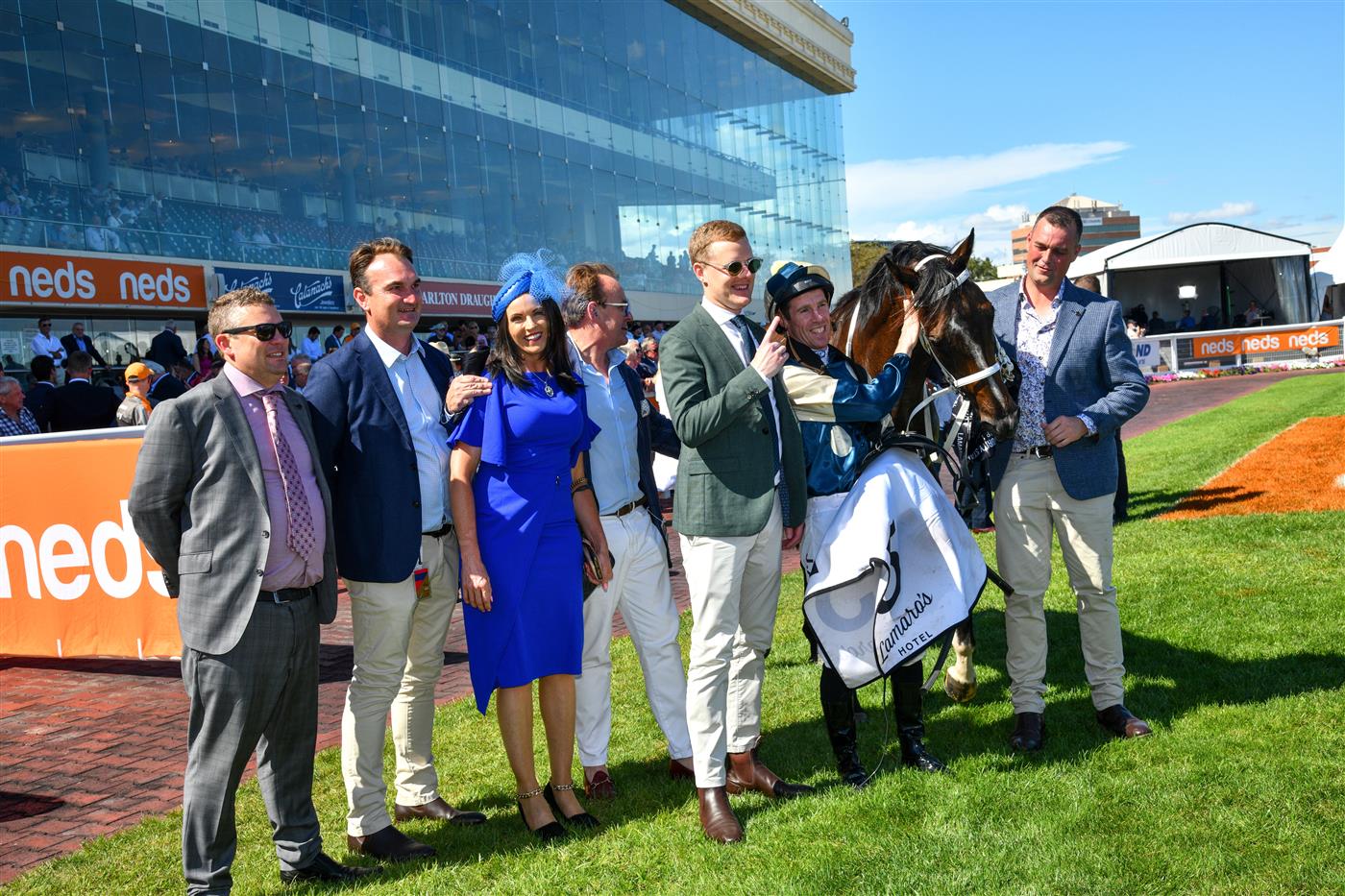 MELBOURNE, AUSTRALIA - FEBRUARY 26: John Allen poses with Trainer Natalie Young and Trent Busuttin after riding Sierra Sue to win Race 6, the Lamaro's Hotel Futurity Stakes, during Melbourne Racing at Caulfield Racecourse on February 26, 2022 in Melbourne, Australia. (Photo by Vince Caligiuri/Getty Images)