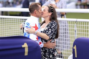 SYDNEY, AUSTRALIA - MARCH 05: Hugh Bowman hugs wife Christine after winning race 7 the Furphy Canterbury Stakes on Forbidden Love  during Sydney Racing at Royal Randwick Racecourse on March 05, 2022 in Sydney, Australia. (Photo by Mark Evans/Getty Images)