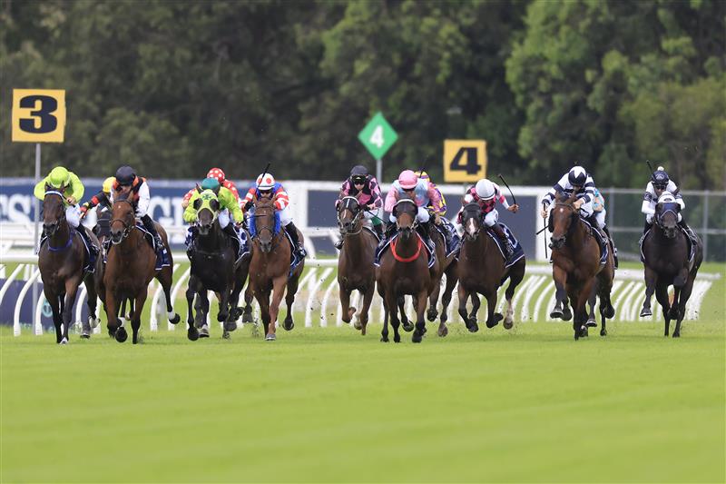 SYDNEY, AUSTRALIA - MARCH 12: Reece Jones on Invincible Kiss (pink/pale blue) wins race 1 the Midway Handicap during Sydney Racing Chandon Ladies Day at Rosehill Gardens on March 12, 2022 in Sydney, Australia. (Photo by Mark Evans/Getty Images)
