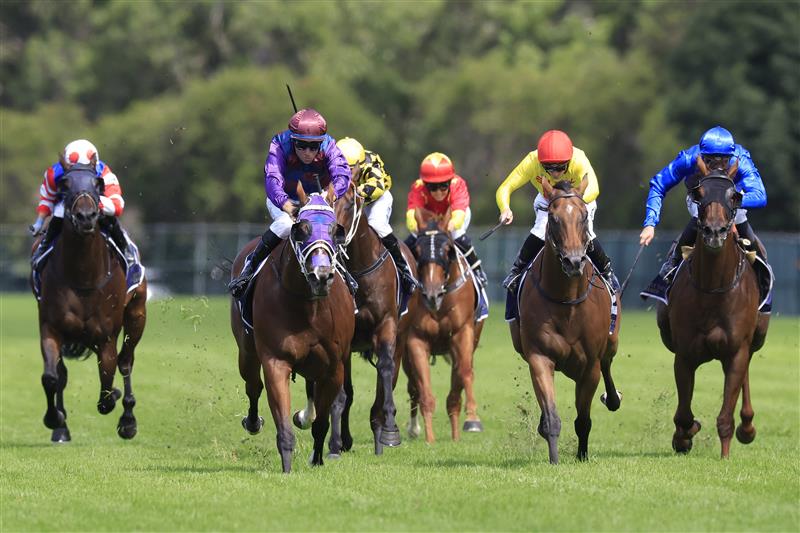SYDNEY, AUSTRALIA - MARCH 12: Tommy Berry on Shelby Sixtysix (purple) wins race 5 the City Tattersalls Group Maurice McCarten Stakes during Sydney Racing Chandon Ladies Day at Rosehill Gardens on March 12, 2022 in Sydney, Australia. (Photo by Mark Evans/Getty Images)