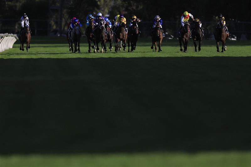 SYDNEY, AUSTRALIA - MARCH 12: Tommy Berry on Rousseau (white cap) wins race 10 the Corrine Handicap during Sydney Racing Chandon Ladies Day at Rosehill Gardens on March 12, 2022 in Sydney, Australia. (Photo by Mark Evans/Getty Images)