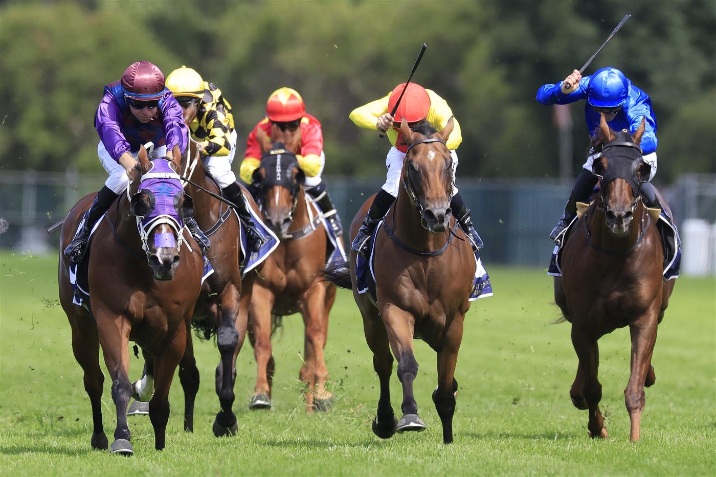 SYDNEY, AUSTRALIA - MARCH 12: Tommy Berry on Shelby Sixtysix (purple) wins race 5 the City Tattersalls Group Maurice McCarten Stakes during Sydney Racing Chandon Ladies Day at Rosehill Gardens on March 12, 2022 in Sydney, Australia. (Photo by Mark Evans/Getty Images)